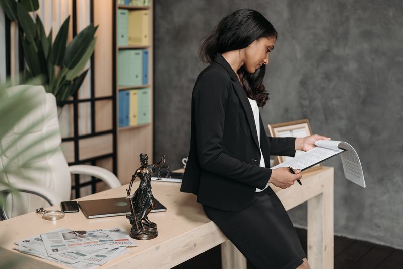 Professional reviewing contract documents at a desk